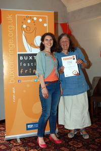 Barbara Wilson (right) collects the Film award on behalf of Buxton Film from Maria Carnegie