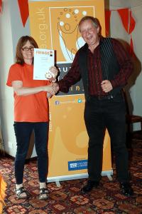 Sam Slide collects his award for 'Spirit of the Fringe' from Marketing Officer Stephanie Billen