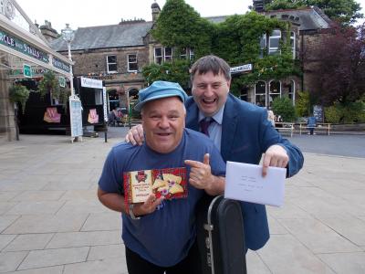 Darren Poyzer and Keith Large exchanging presents