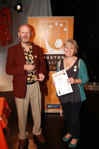 Fringe chair Keith with Caroline Small of The Green Man Gallery accepting an award on behalf of guitarist Richard Haslam (credit: Ian J. Parkes)