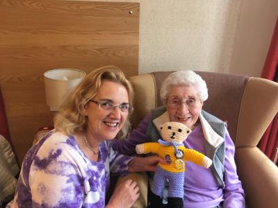 Linda receives a homemade thank you bear from a resident at Haddon Hall. 