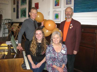 Gathering round the piano: clockwise, Tim Mottershead, Fringe chair Keith Savage, the Green Man's Caroline Small and Rebecca Mottershead at the piano for the Fringe 40 Village Carols event