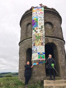 An Alternative Well Dressing banner goes walkies up to Solomon's Temple during Fringe 2020 (credit: Two Left Hands)