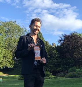 Comedian Nathan Cassidy with Fringe Flyer in the Pavilion Gardens  (credit: Gemma Ball)