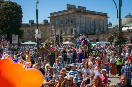 Crowds outside the Crescent enjoy the Fringe/BIF carnival float (credit: Alan Wilkinson, Chapel Camera Club 2022)