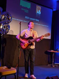 Compere Edy Hurst on his guitar at the 2023 Fringe Launch Party (credit: Gemma Ball)