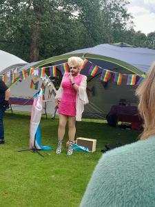 Crudi Dench entertains at the High Peak Pride Picnic (RH)