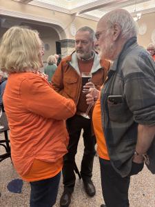  Linda Rolland and Ian Hamilton talk to interested attendee, Adrian (MK)