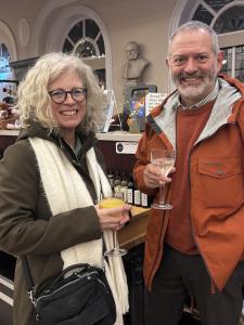 Hilary and Adrian raise a glass