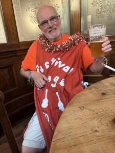 Volunteer Ian enjoys a well earned pint after a busy carnival day! (credit: Moira Kean)