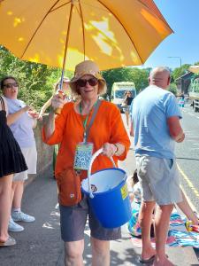 Pam collects for the Well Dressing charities (MC)