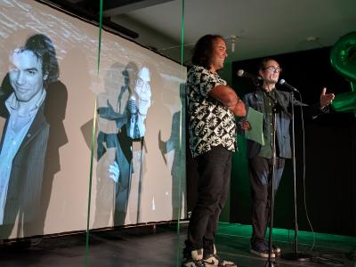 Underground's Yaz Al-Shaater and Tom Crawshaw against a backdrop of their younger selves at the Fringe Launch Party 2025 (credit: Dan Osborne) 