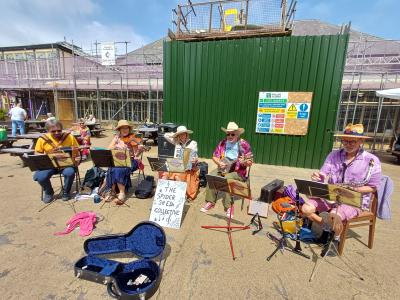 The Spider Shed Collective busking outside the Pavilion Gardens (SB 2026)