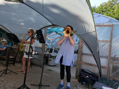 Jazz duo Sax 'n' Slide entertains at the Serpentine Community Gardens' Ugly Bug Ball (DO) 