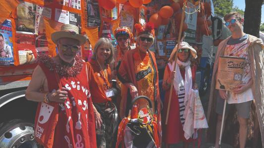 Ian H, Stephanie, Dan, Julie, Catherine and performer Callum beside the 2026 Carnival float (credit: Moira Kean)