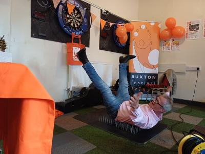 He's done it! Charles Lloyd at the Programme Party 2026 recreating a memorable stage moment lying on a bed of nails (credit: Stephanie Billen 2026)